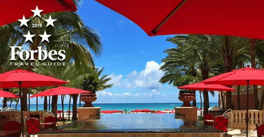 Acqualina Resort & Spa with giant red umbrellas